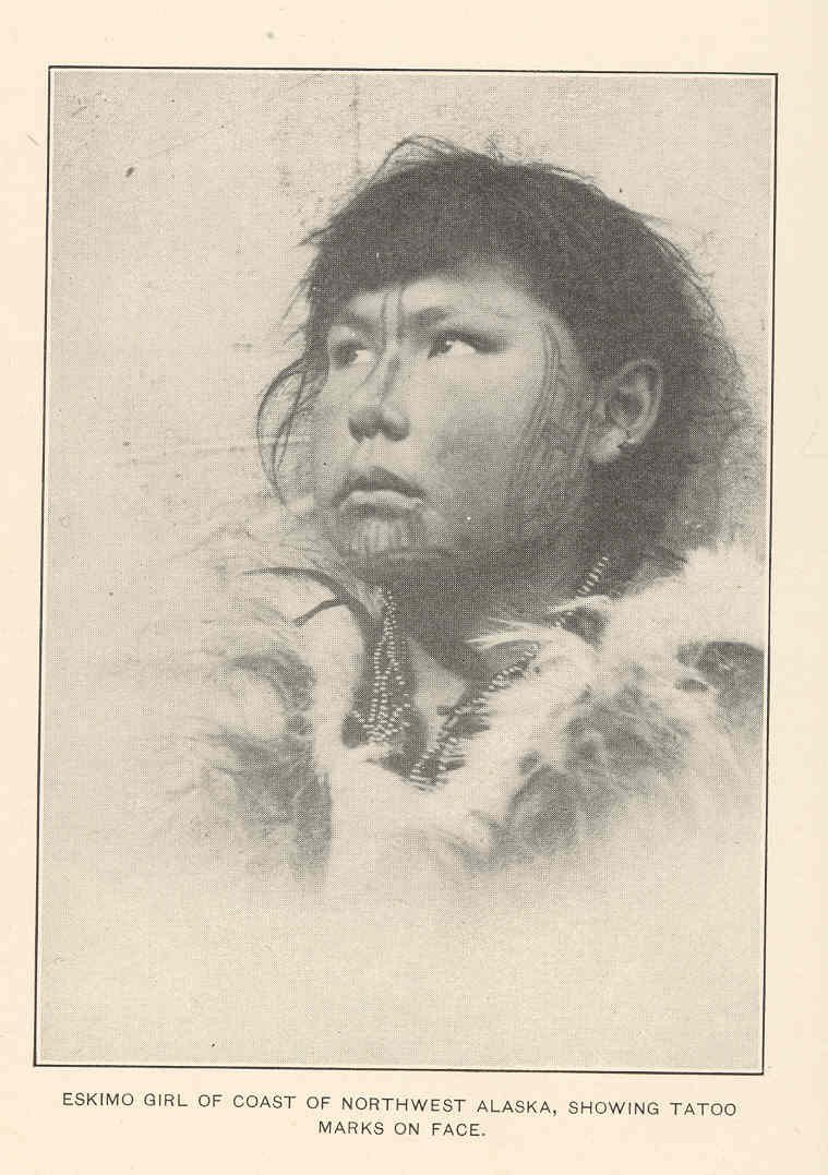 Eskimo girl of Alaska with tattoo marks on face.